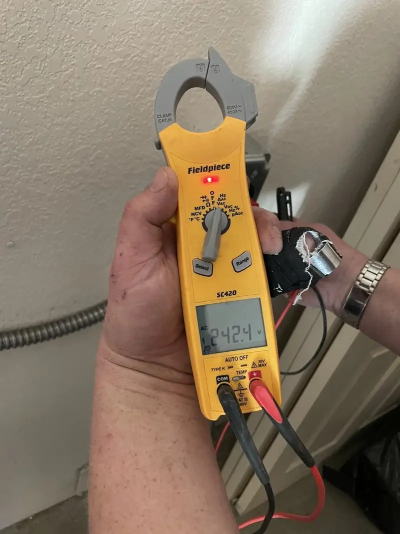 Voltage testing with clamp meter during Electrical Installation Services in Ashby
